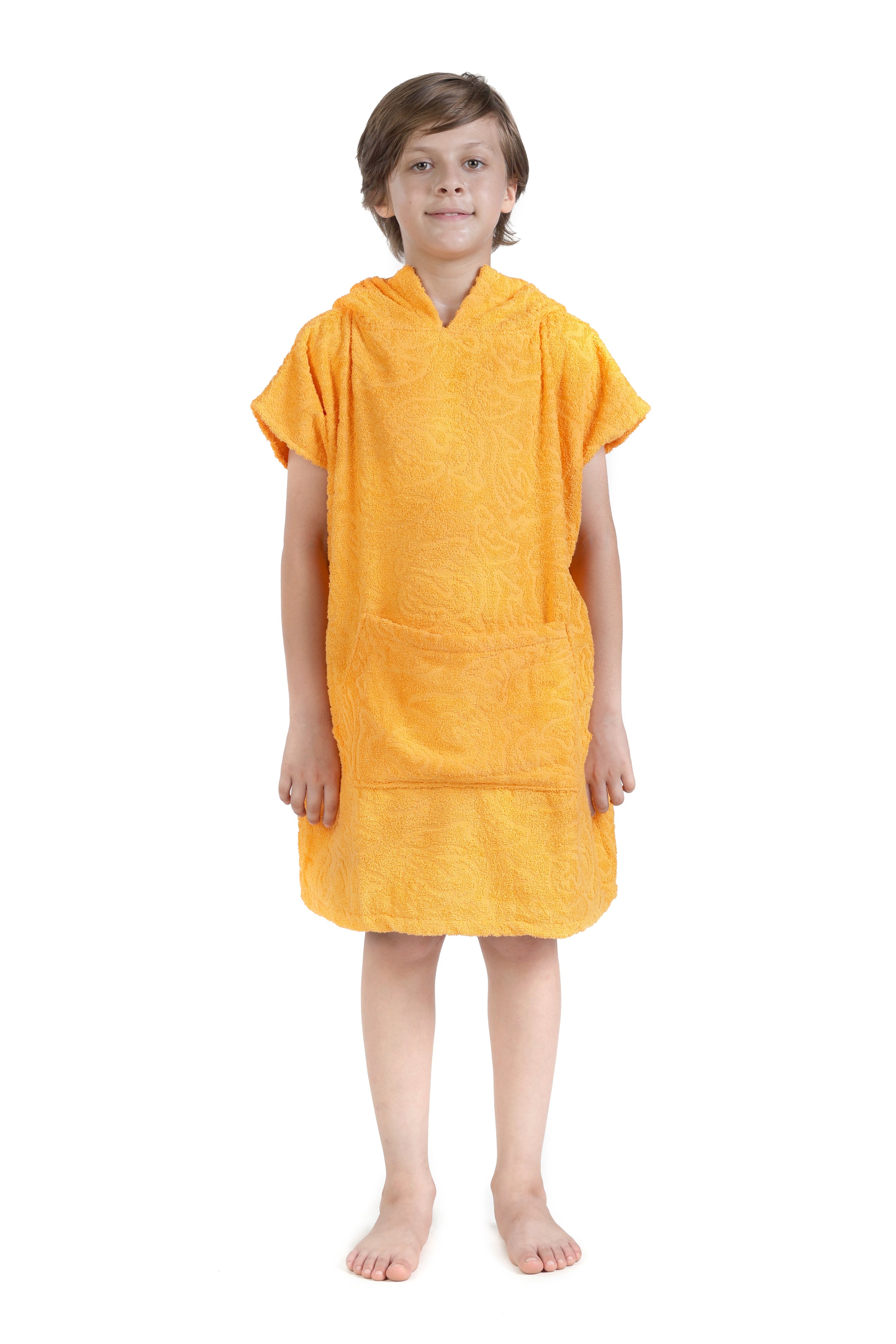 Child wearing a yellow towel dress on a white background