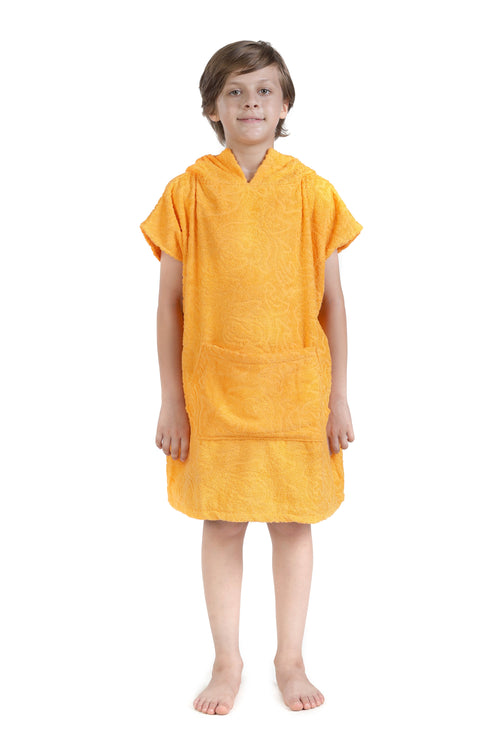 Child wearing a yellow towel dress on a white background